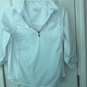 White shirt by Coral Bay that flares a little on the sides.